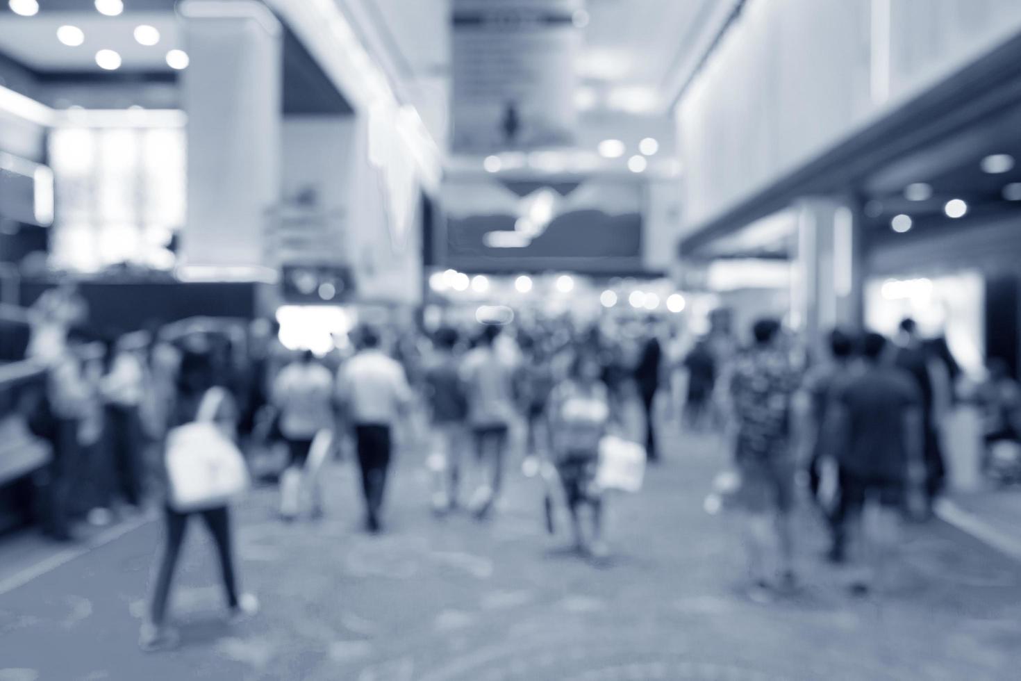 Abstract blurred people in exhibition, expo in hall photo
