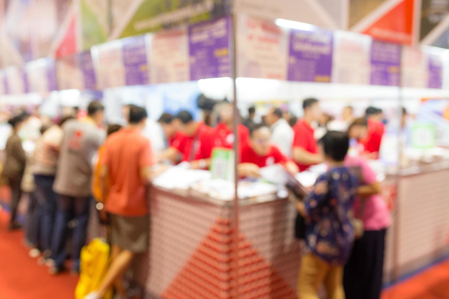 Abstract blurred people in exhibition, expo in hall photo