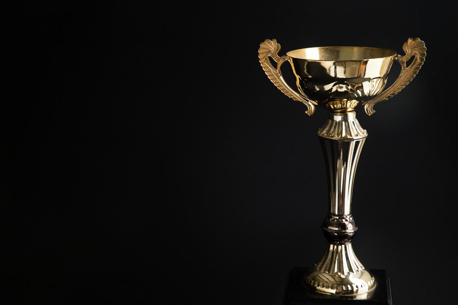 Trophy award on black background photo