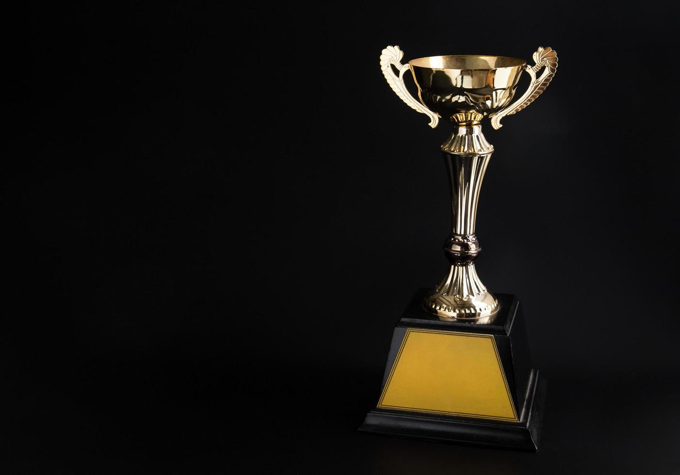 Trophy award on black background photo