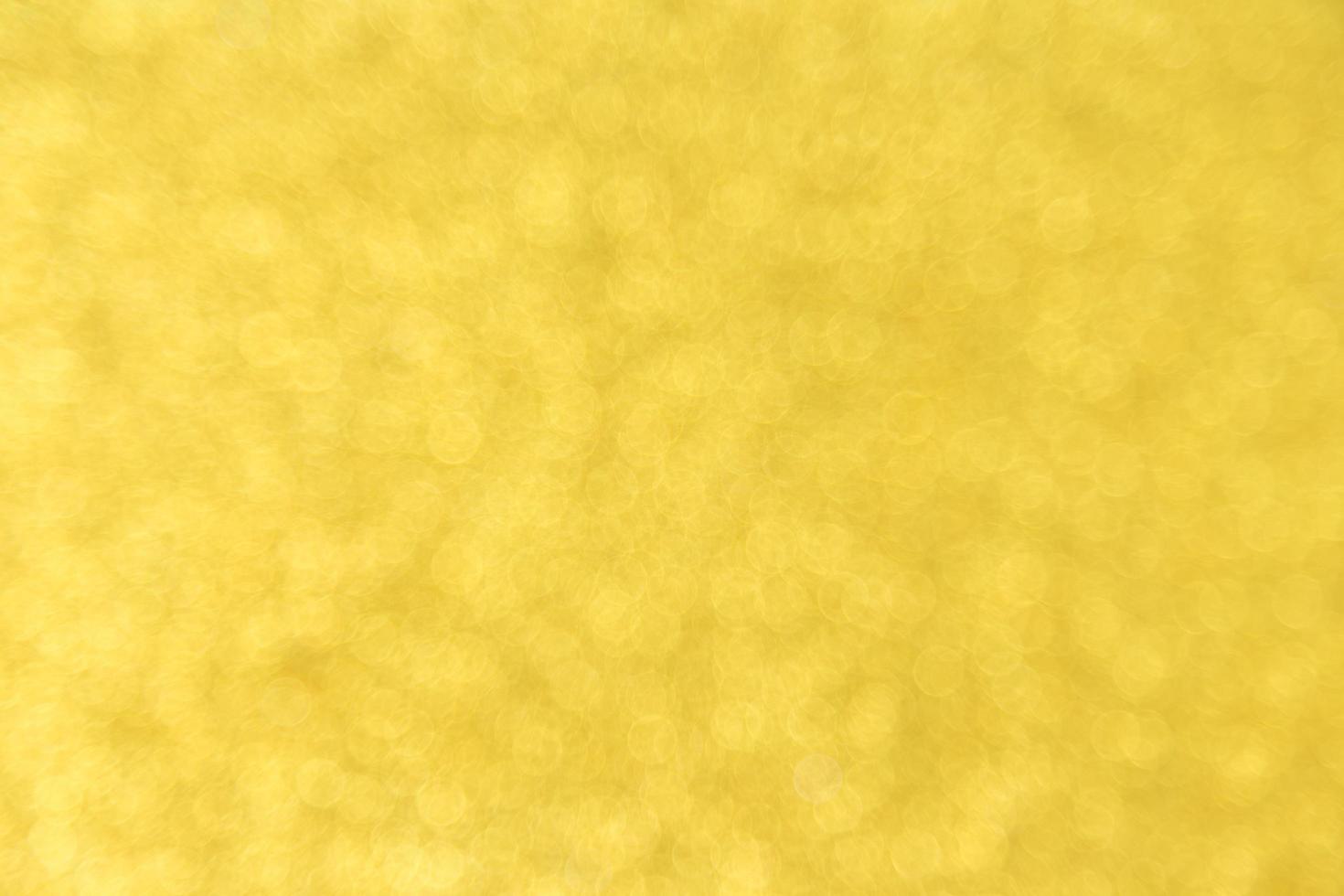 Abstract golden bokeh background photo