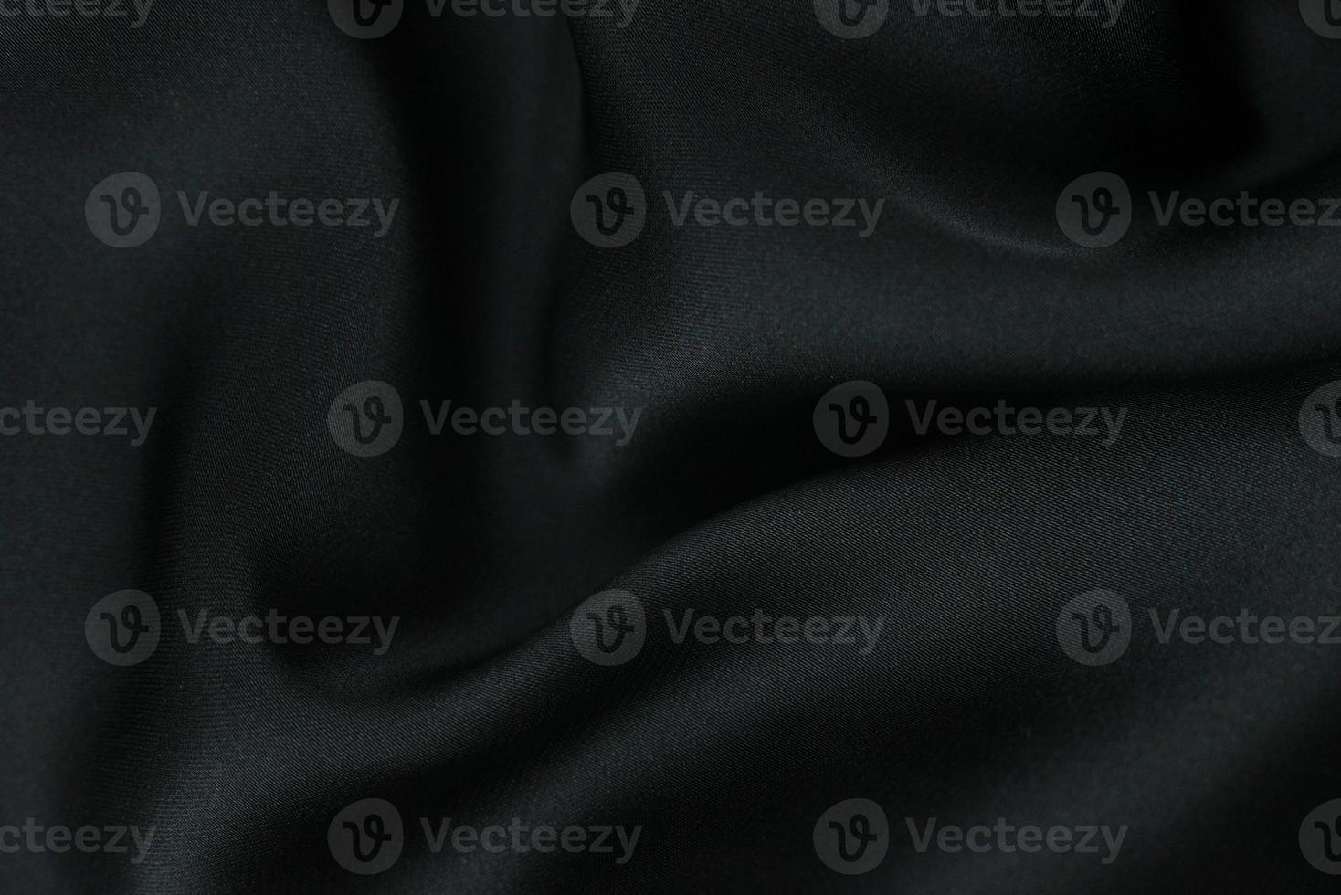 tela de fondo. Tejido textil oscuro con textura y patrón de fondo de cortinas foto