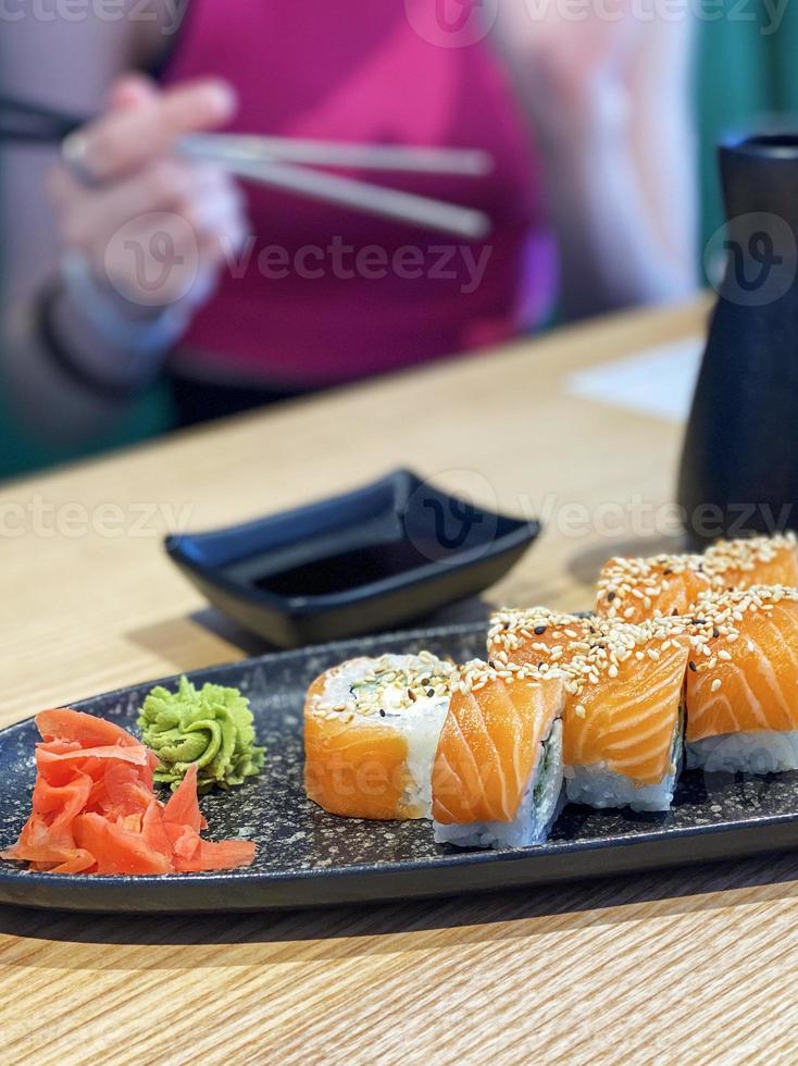 Eating roll sushi photo