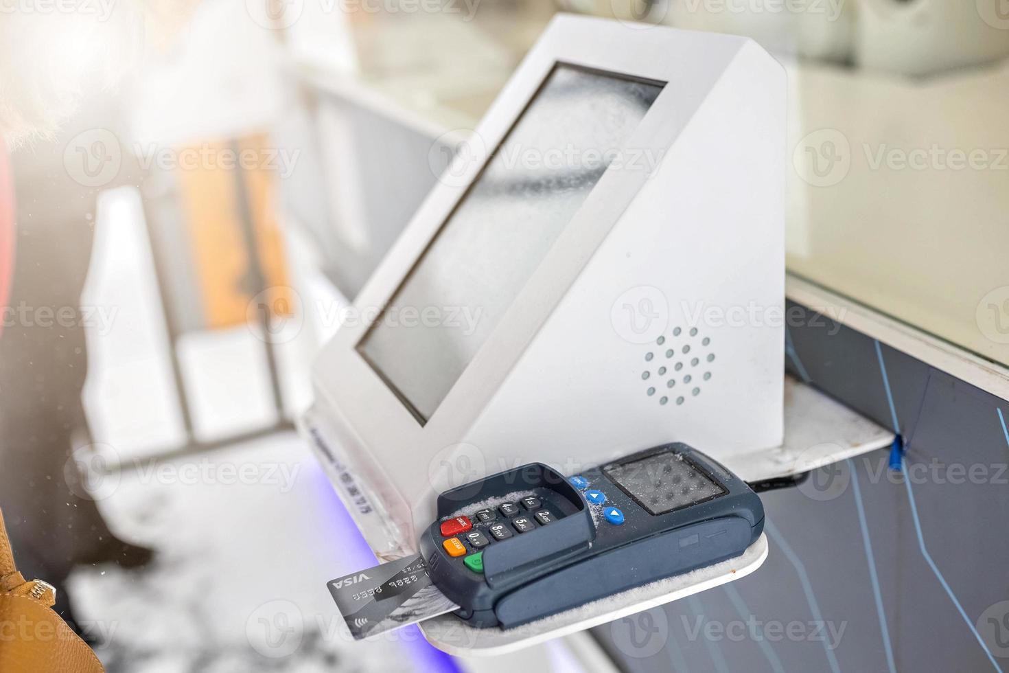 Payment using a debit credit bank card via a payment terminal photo