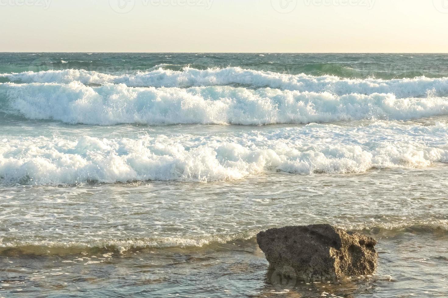 The coast of the Mediterranean Sea. The waves. The horizon. Sky and sea in summer photo