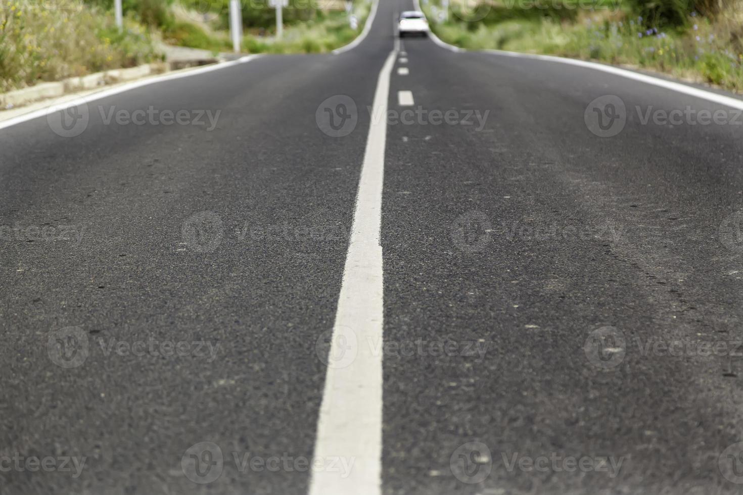 Direction line for cars on a road photo