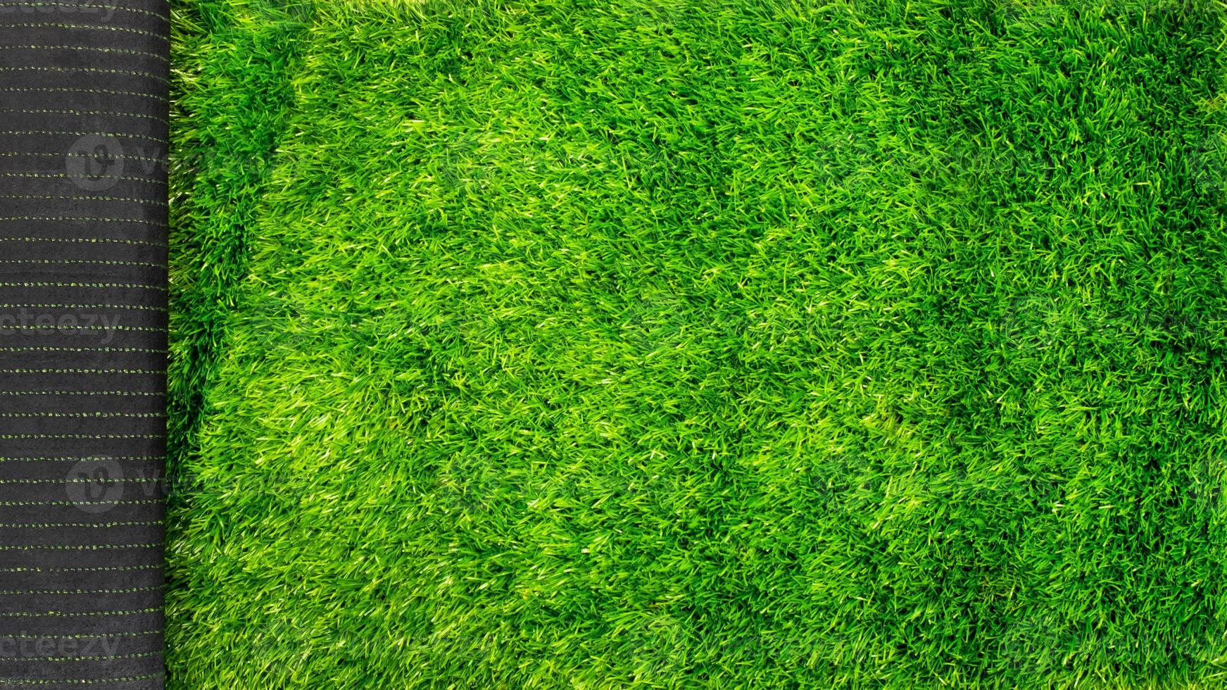artificial grass turf for sports fields green lawn mockup with copy space photo