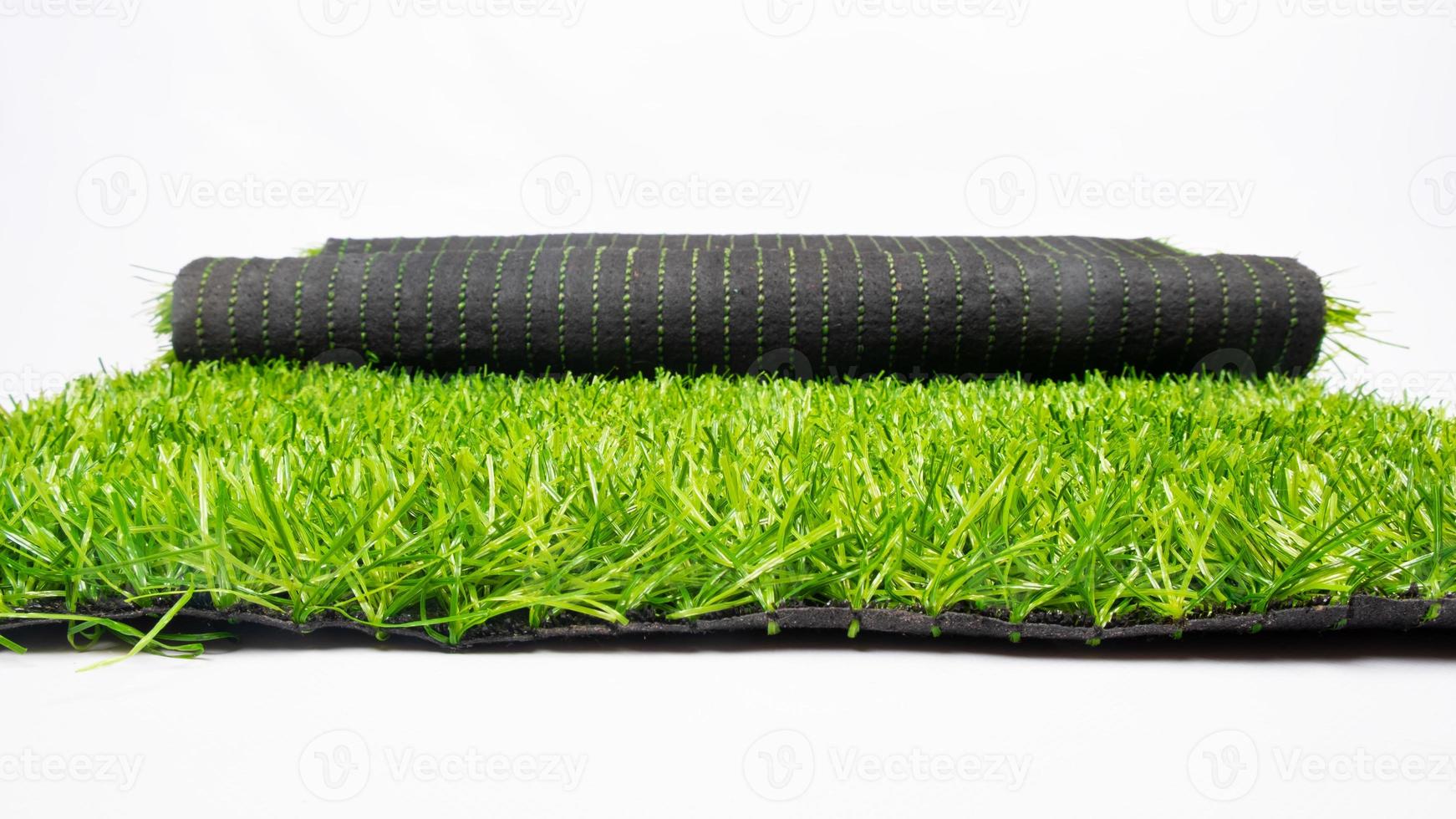 roll of artificial green grass isolated on white background, lawn photo