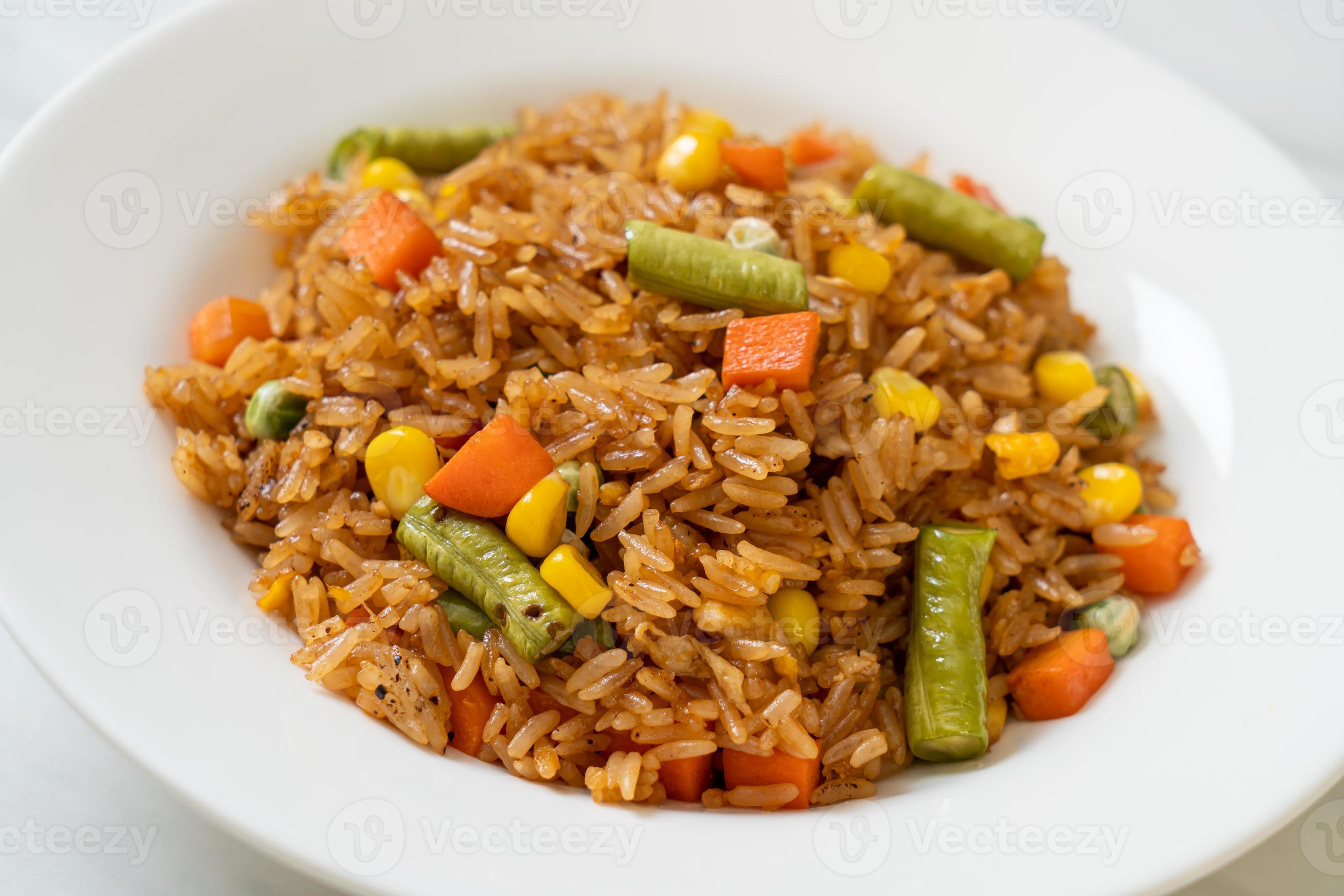 Fried rice with green peas, carrots, and corn vegetarian and healthy