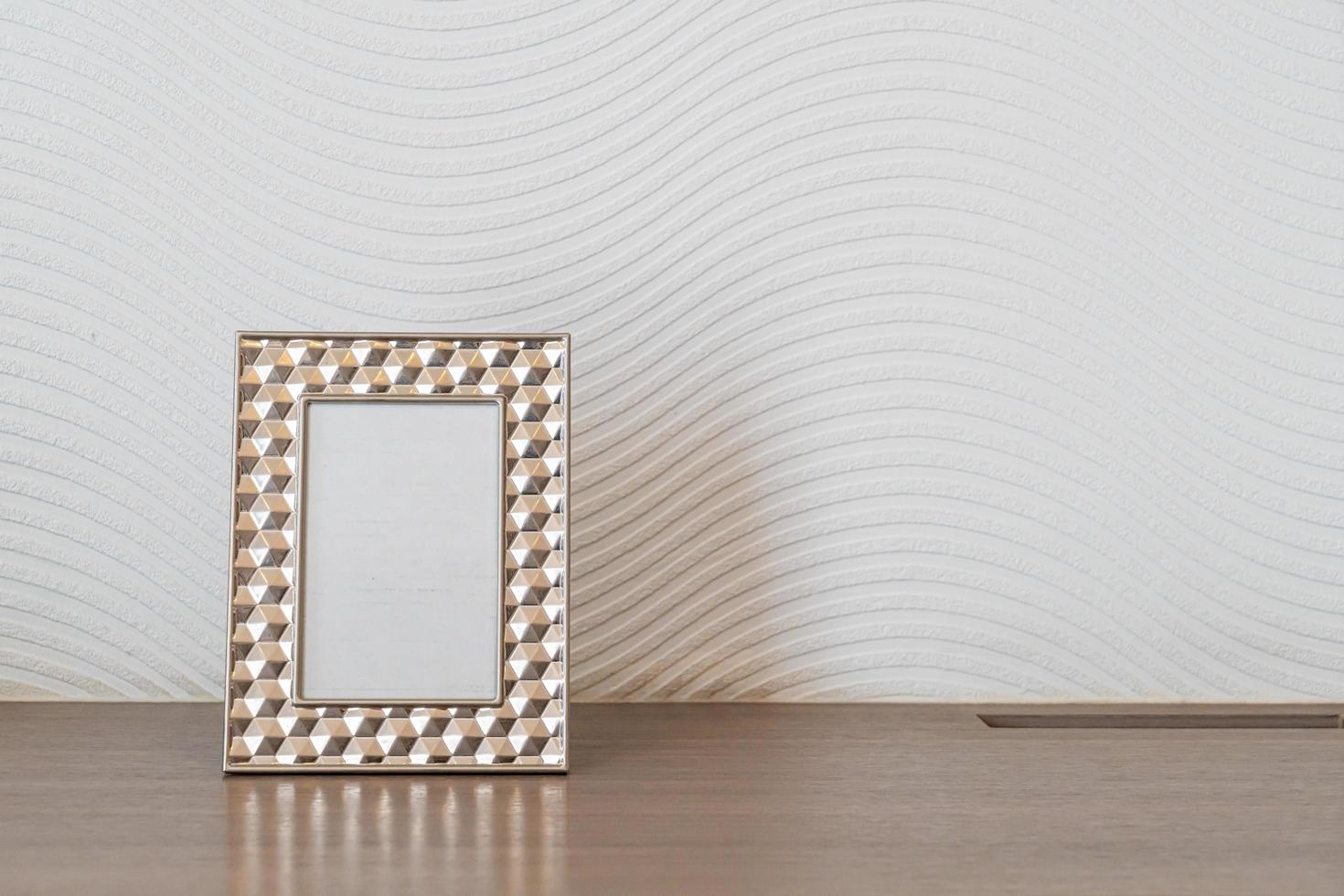 Empty picture frame decoration on white wall with copy space photo