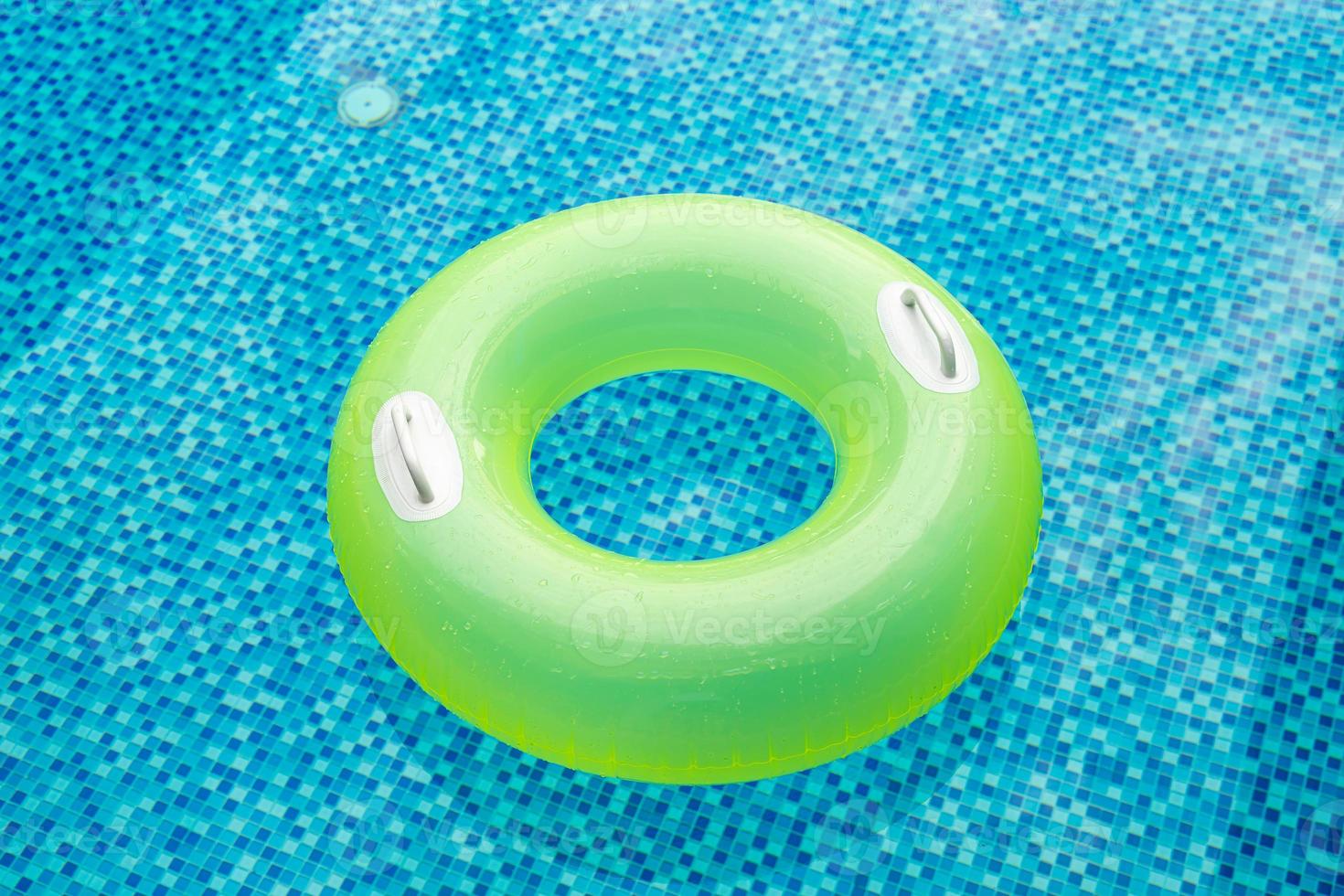 Swim ring in blue swimming pool photo
