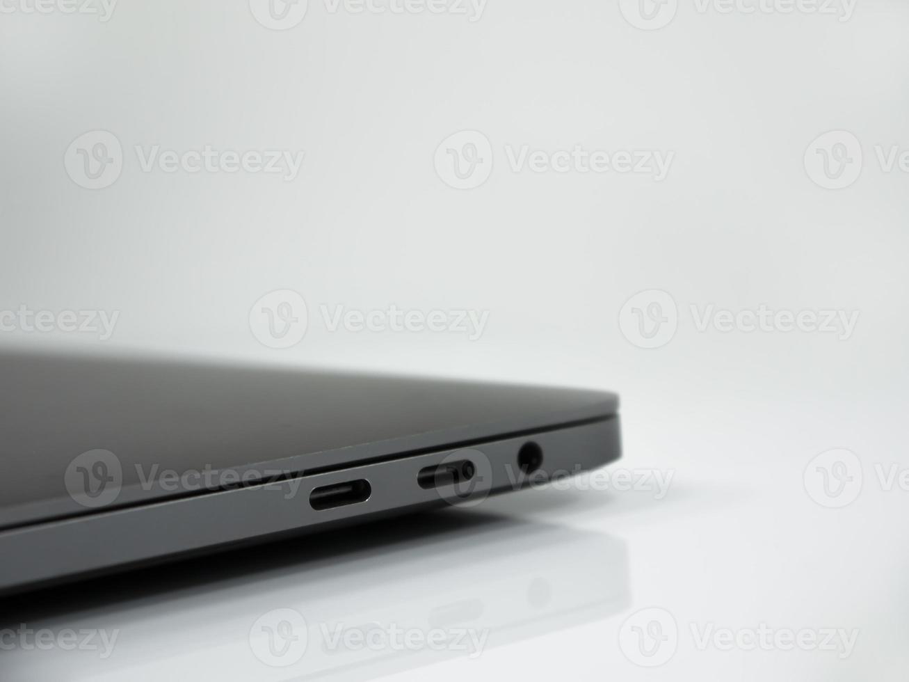 Tipe C connectors on the laptop . White background photo