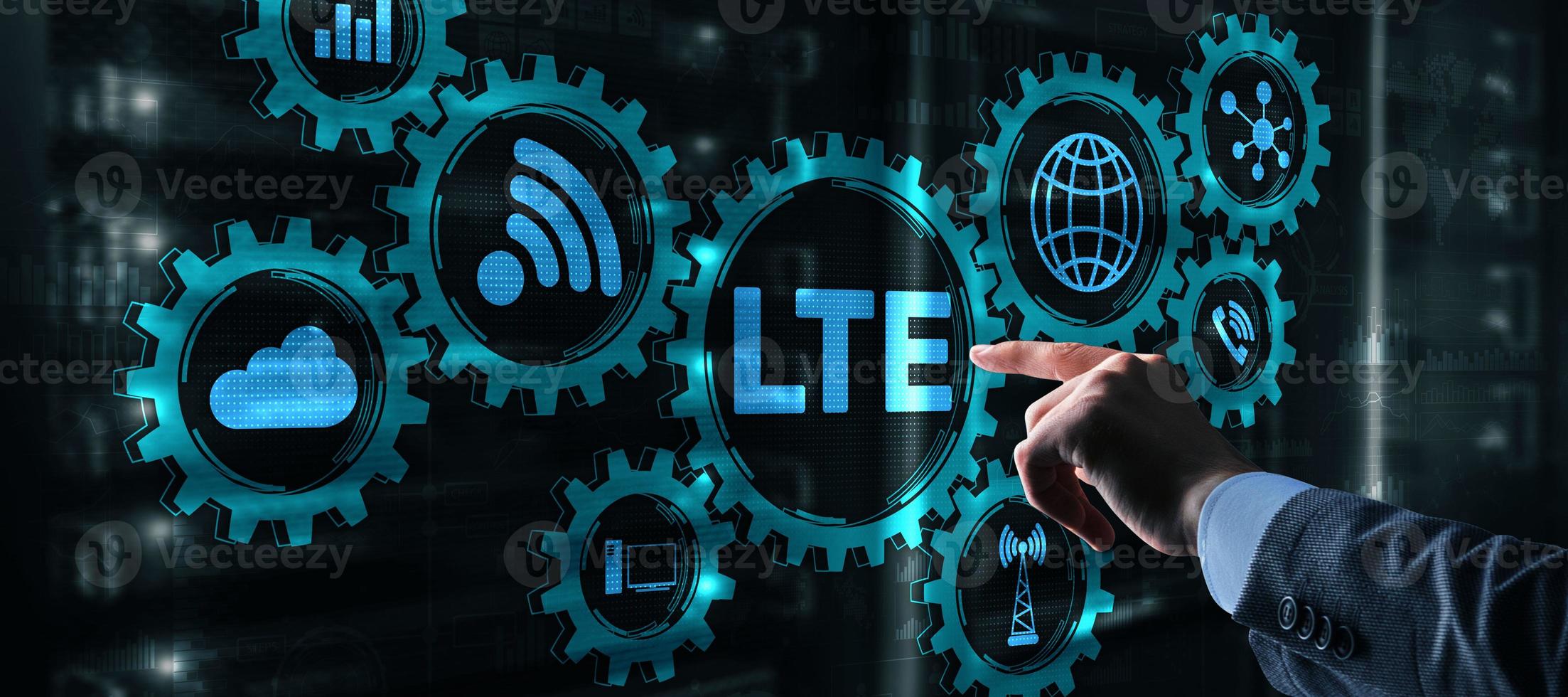 LTE concept on Server Room Background. Young business man presses with a finger LTE. photo