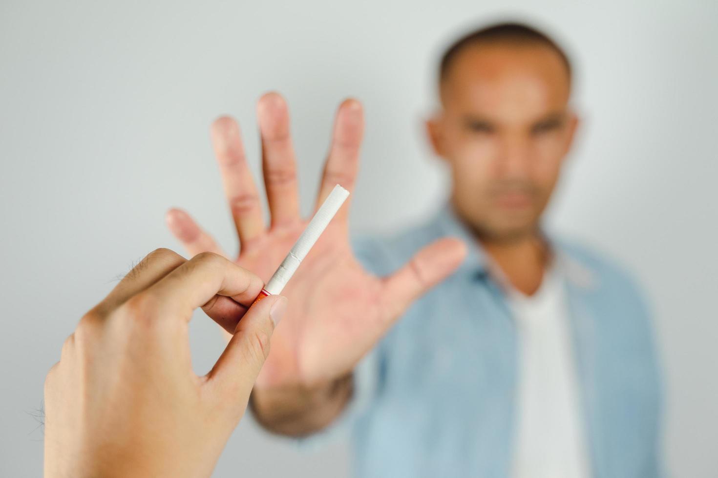 Man refusing a cigarettes. Concept Quitting smoking,World No Tobacco Day. photo