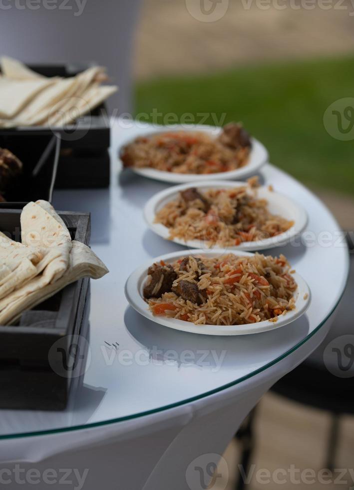 Ready pilaf and served. National dish of oriental cuisine. photo