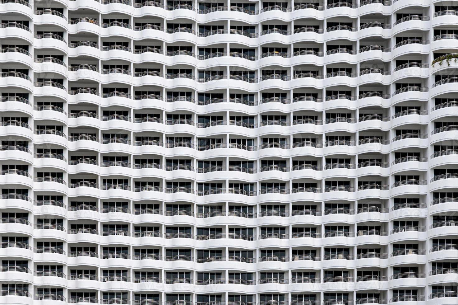 Building facade seamless, Rows of hotel many balcony with curved shape photo