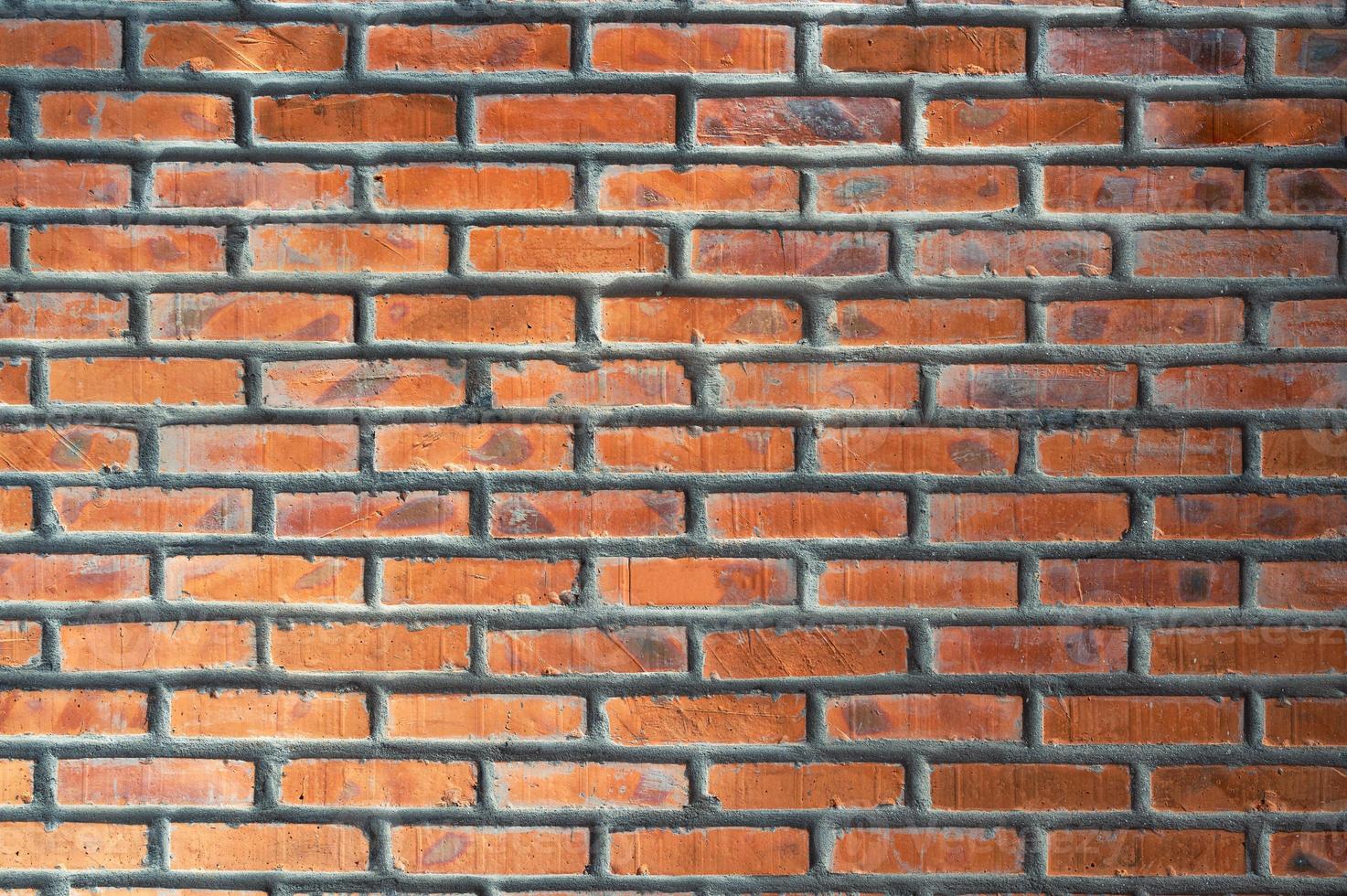 Red brick wall stacked texture background photo