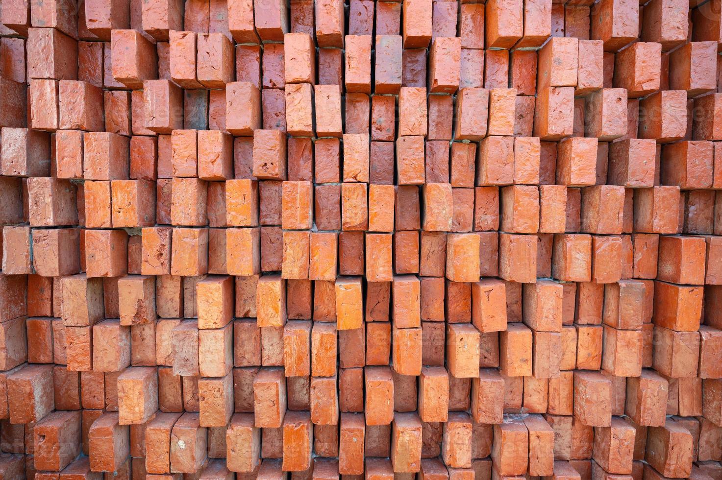Rugged orange brick wall texture background photo