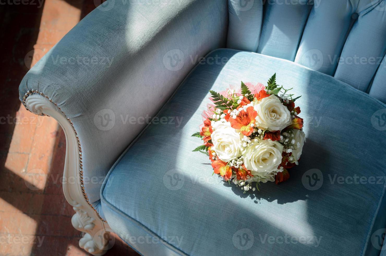 Bridal bouquet in soft antique chair photo
