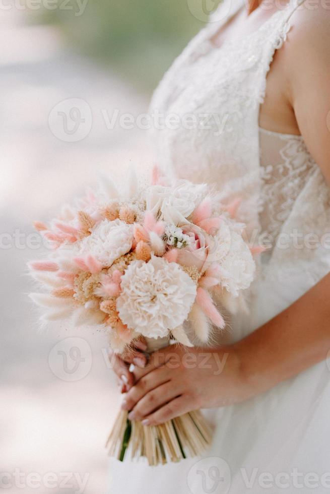 elegant wedding bouquet of fresh natural flowers and greenery photo