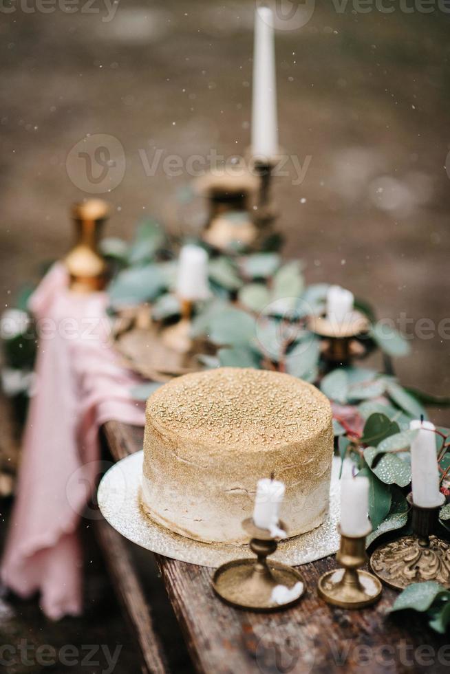 wedding decor with a golden cake photo