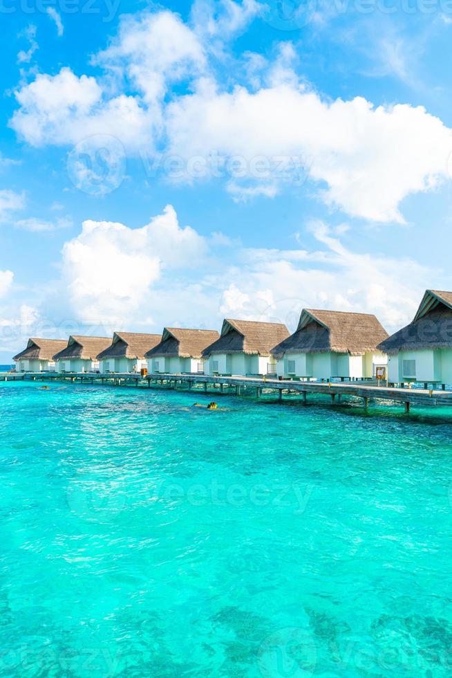 Tropical Maldives resort hotel and island with beach and sea for holiday vacation concept - boost up color processing style photo
