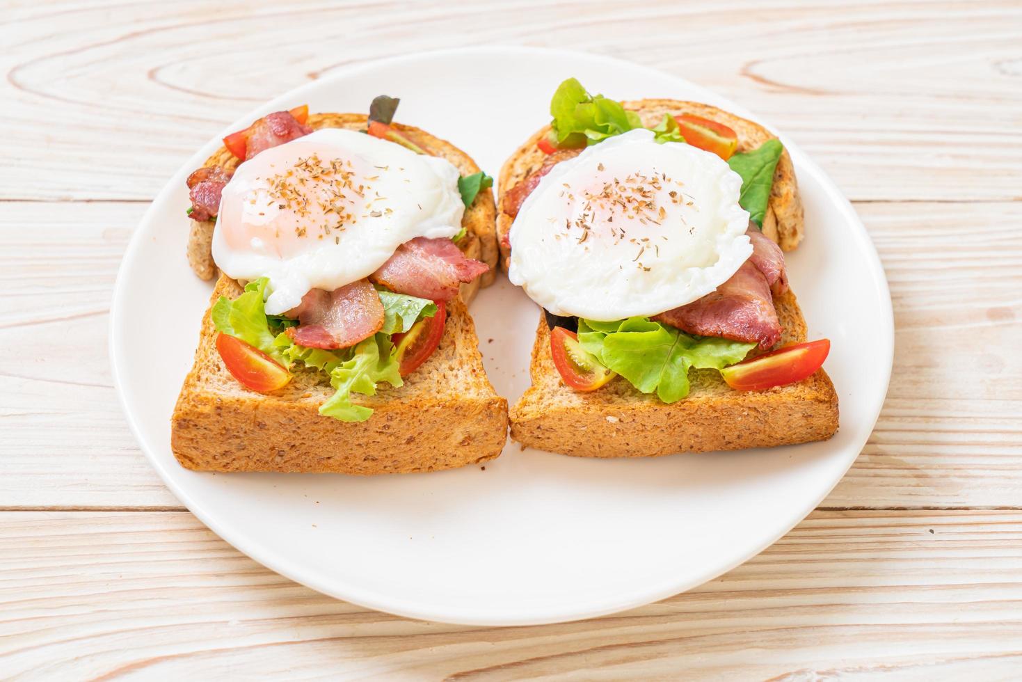 Whole wheat bread toasted with vegetable, bacon, and egg or egg benedict, for breakfast photo