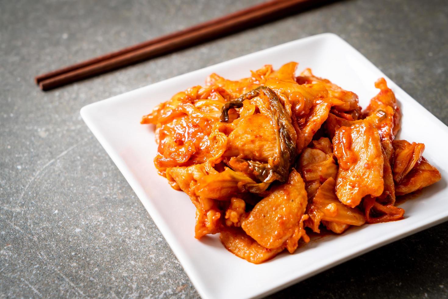 Stir-fried pork with kimchi - Korean food style photo