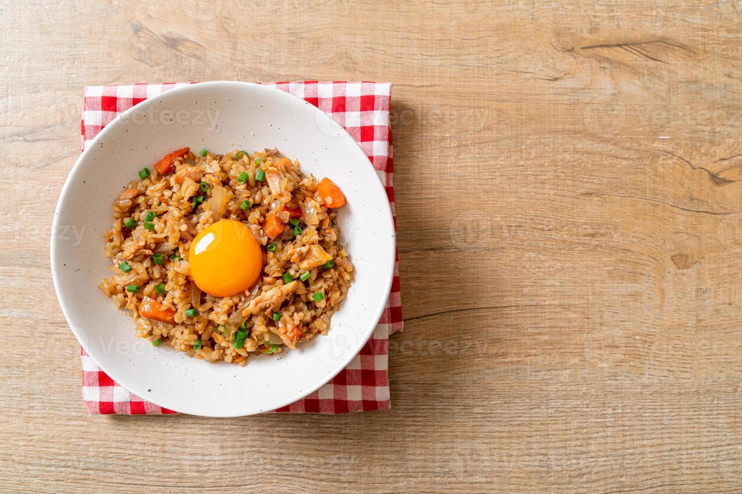 Salmon fried rice with pickled egg on top - Asian food style photo