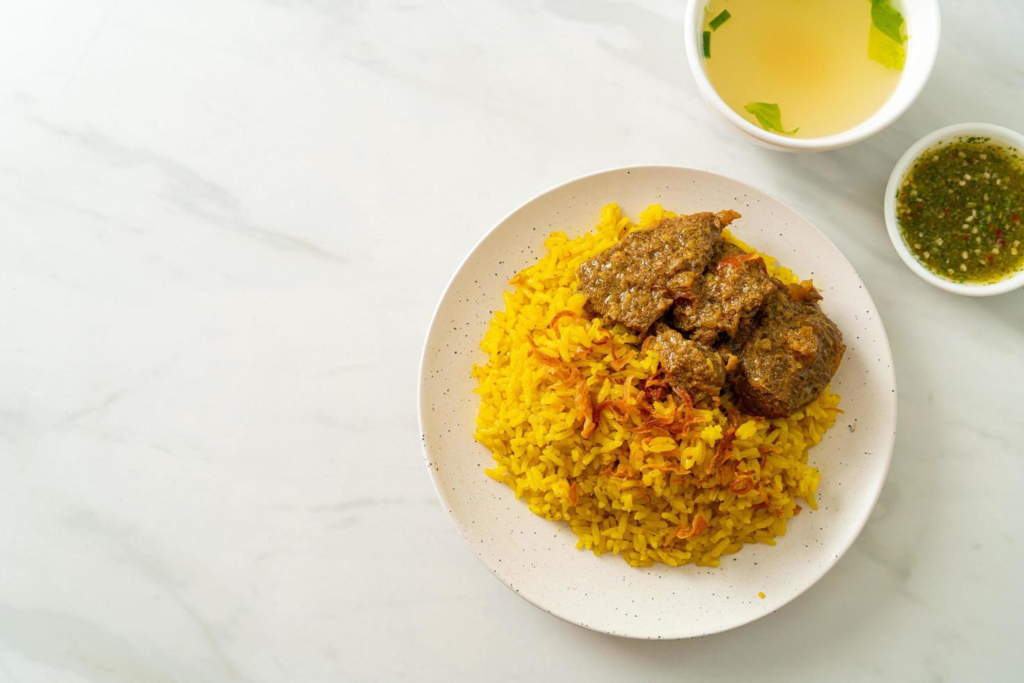 Beef Biryani or Curried rice and beef - Thai-Muslim version of Indian biryani, with fragrant yellow rice and beef photo