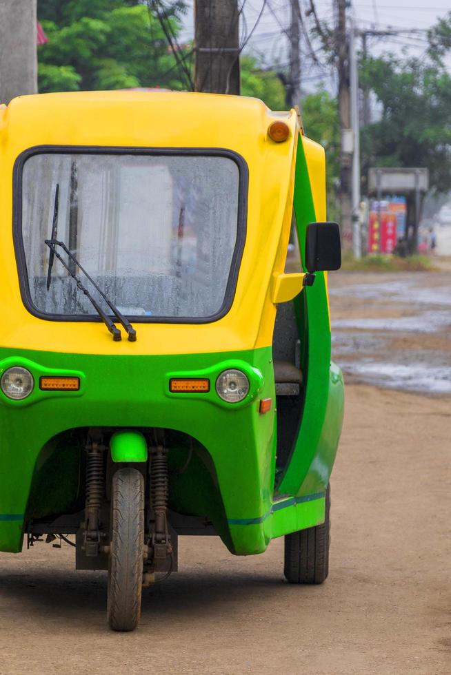 Eco-friendly electronic tuk tuk rickshaw in Luang Prabang Laos. photo