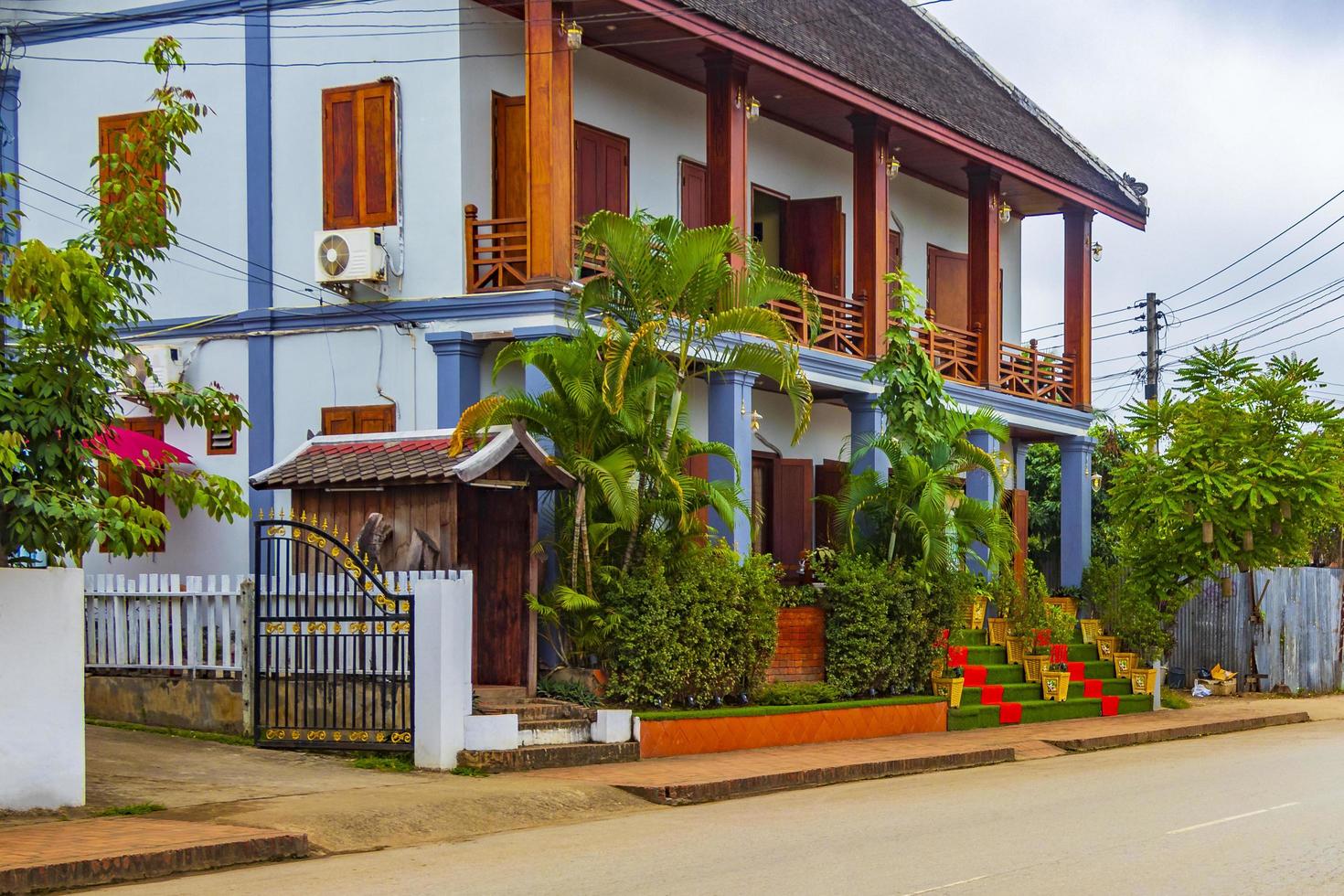 Typical colorful house building in a street Luang Prabang Laos. photo