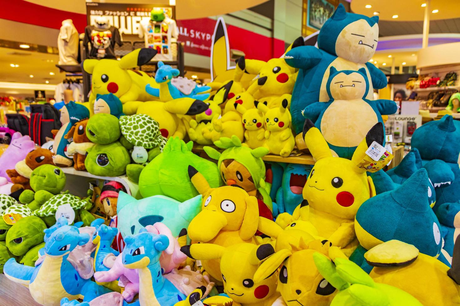 Colorful Pokemon Pikachu plush toys in Bangkok airport Thailand. photo