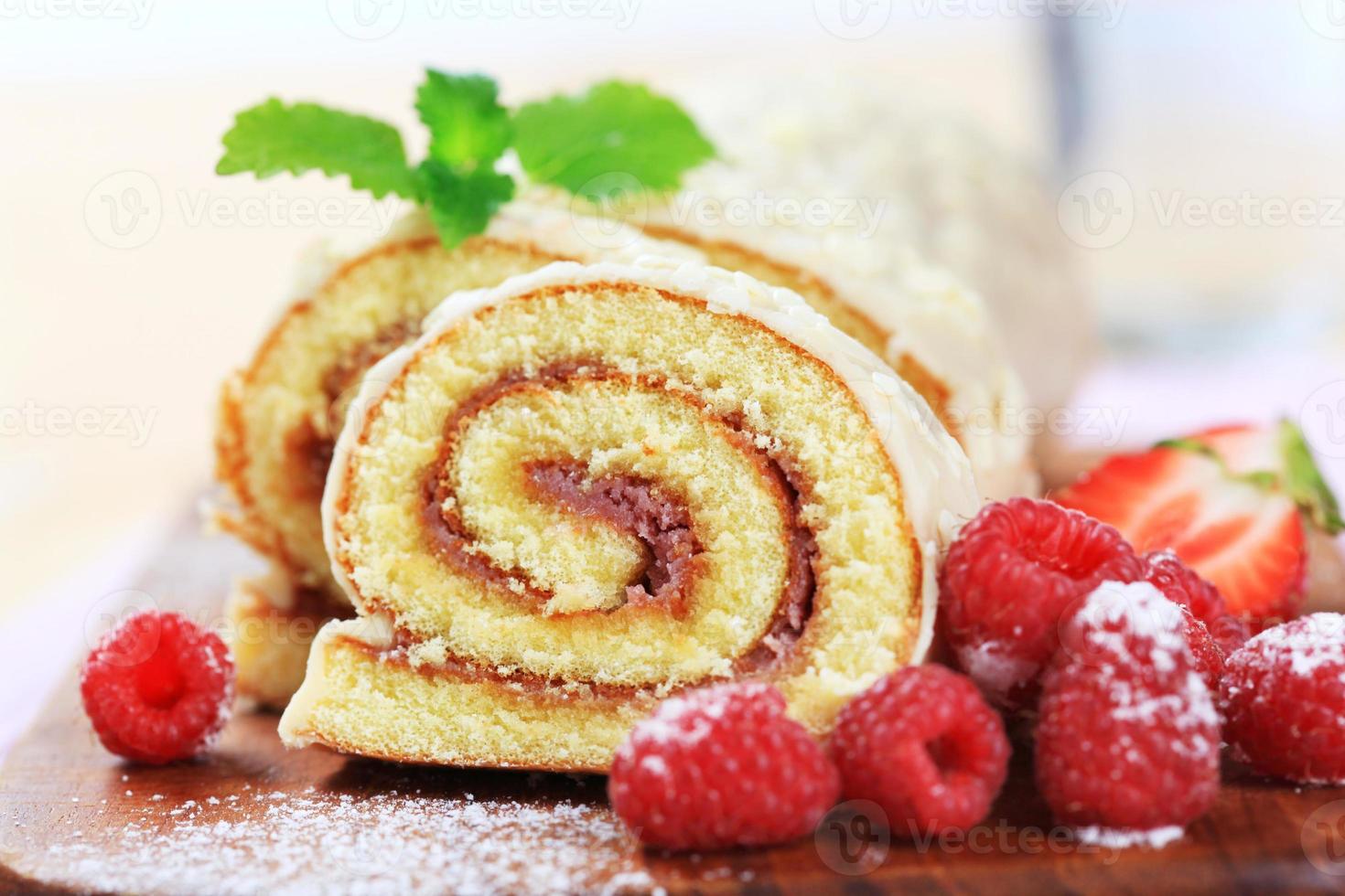 Swiss roll glazed with white chocolate icing photo