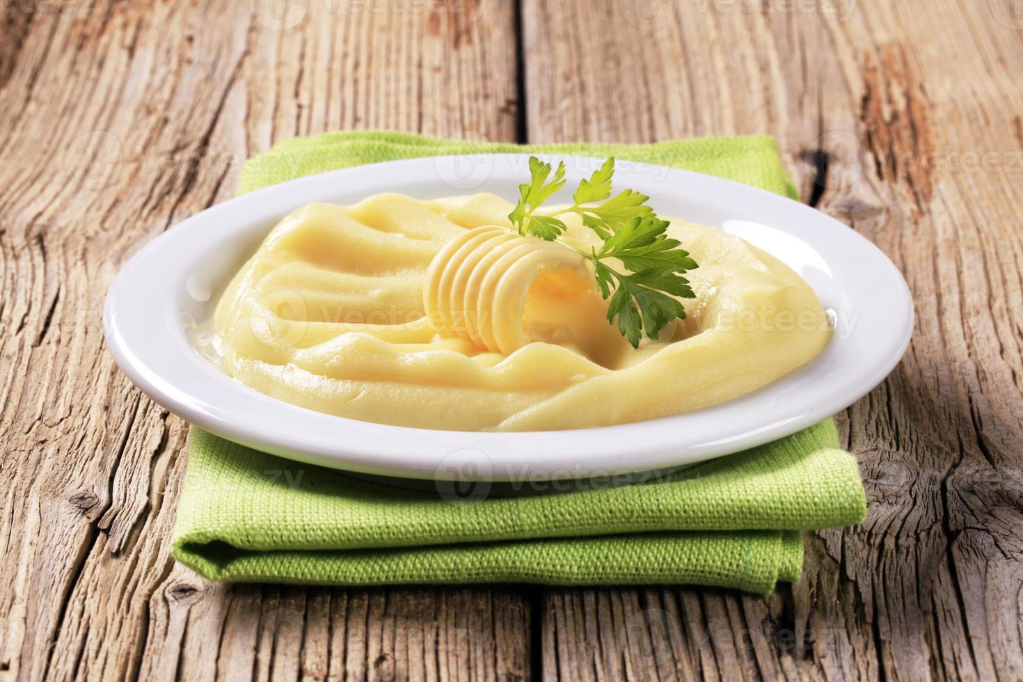 Mashed potato and a curl of fresh butter photo