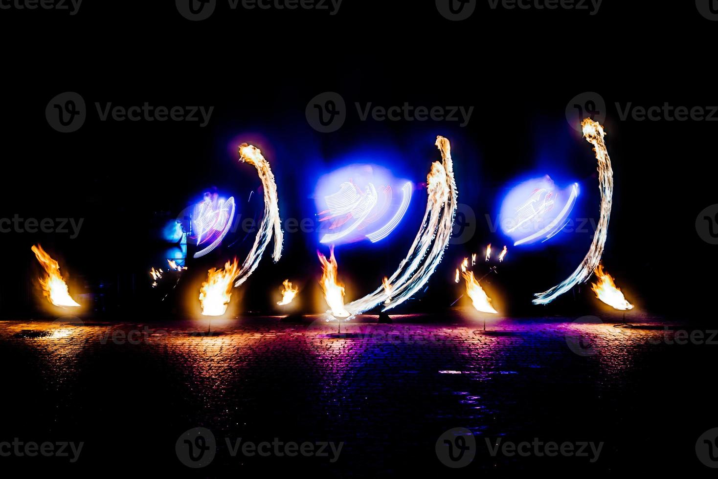 fiery pieces of a fire show photo