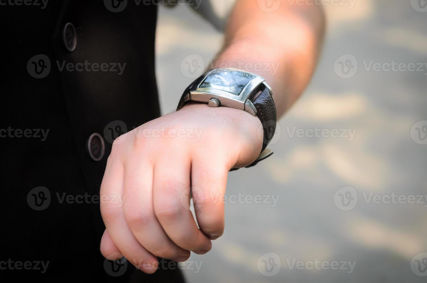 the man  looks watch photo