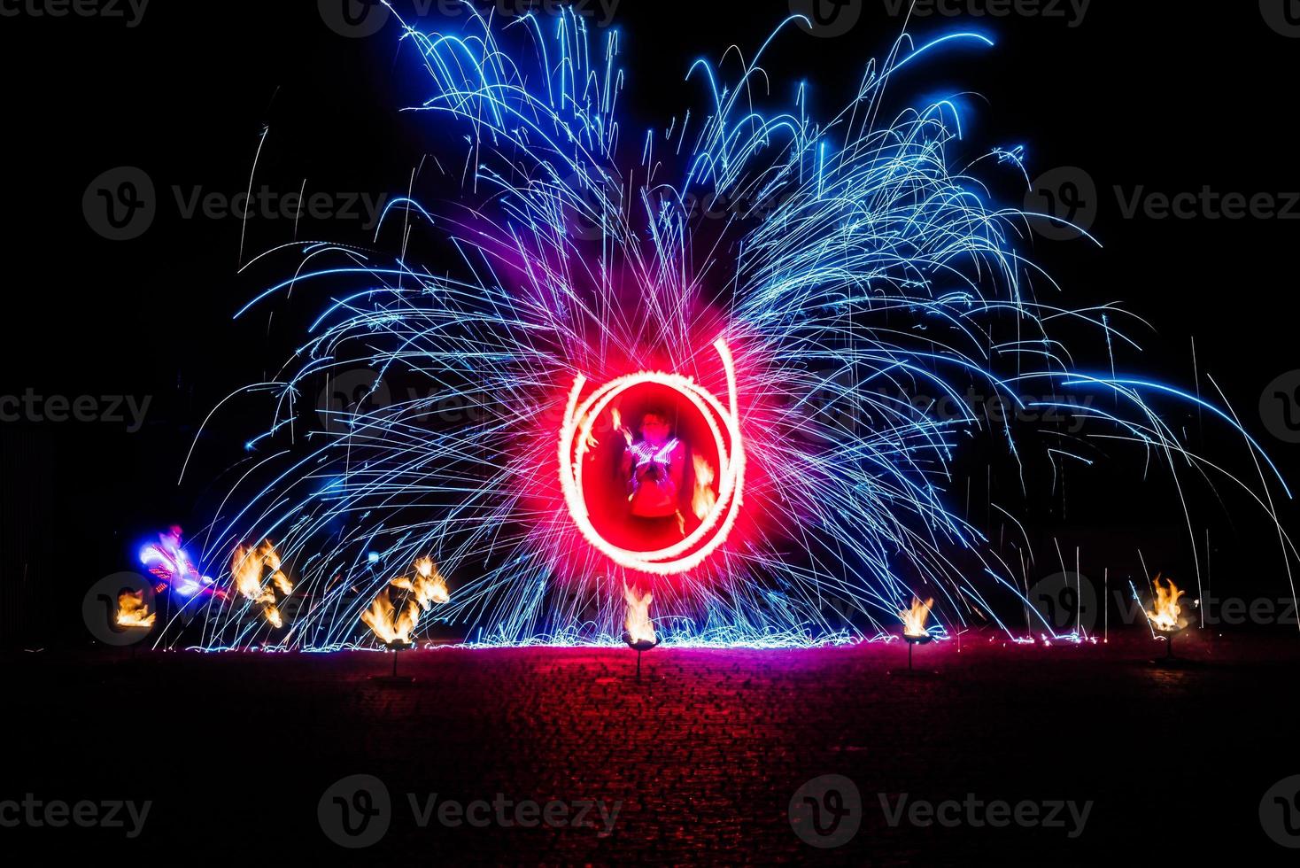 fiery pieces of a fire show photo