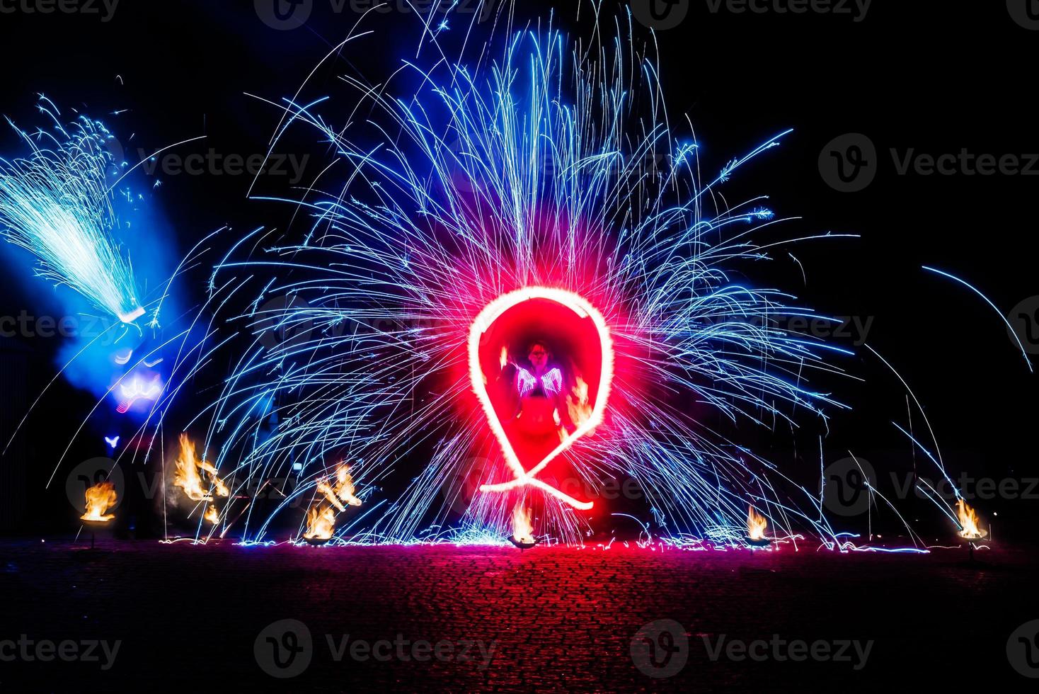 fiery pieces of a fire show photo