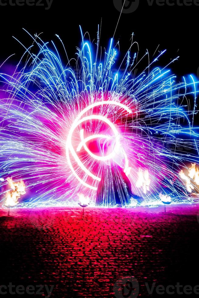 fiery pieces of a fire show photo