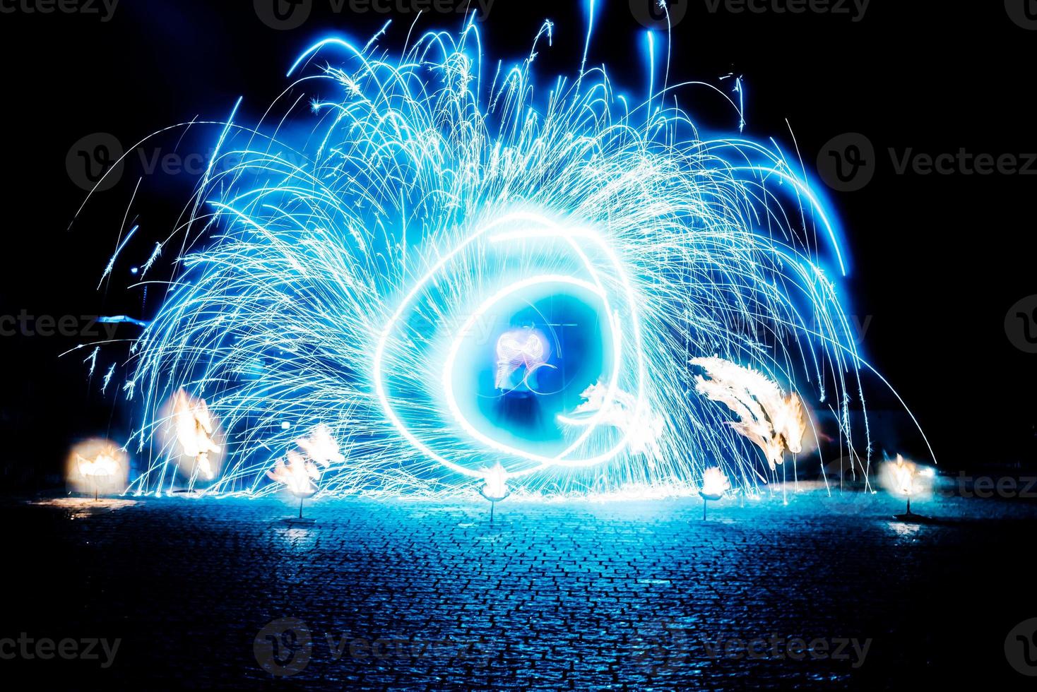 fiery pieces of a fire show photo