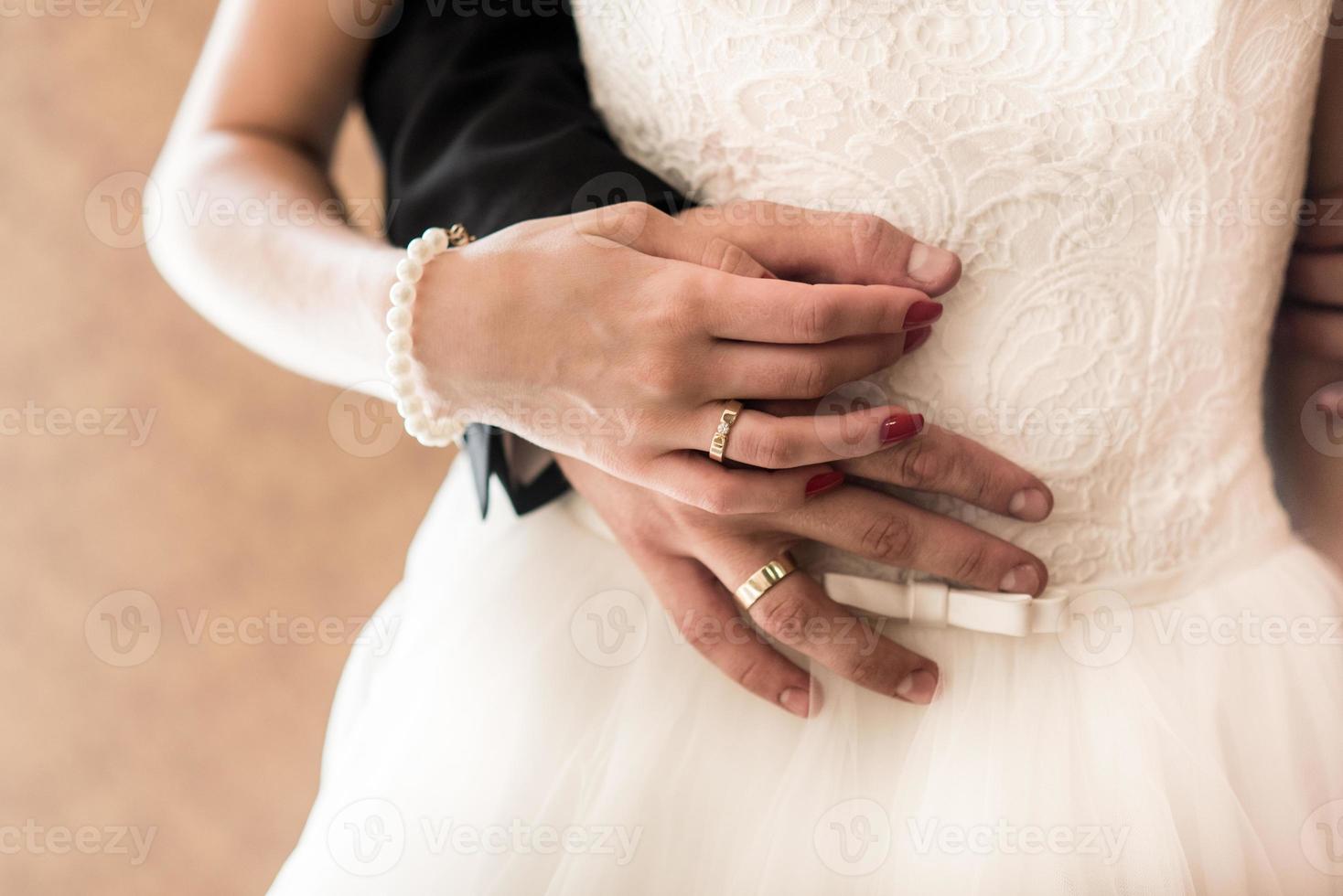 the bride and groom held hands photo