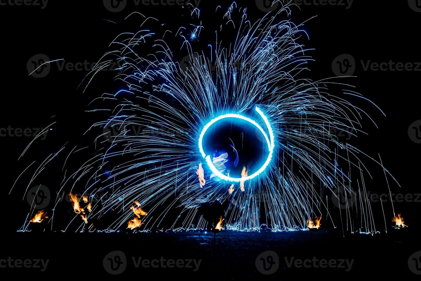 fiery pieces of a fire show photo