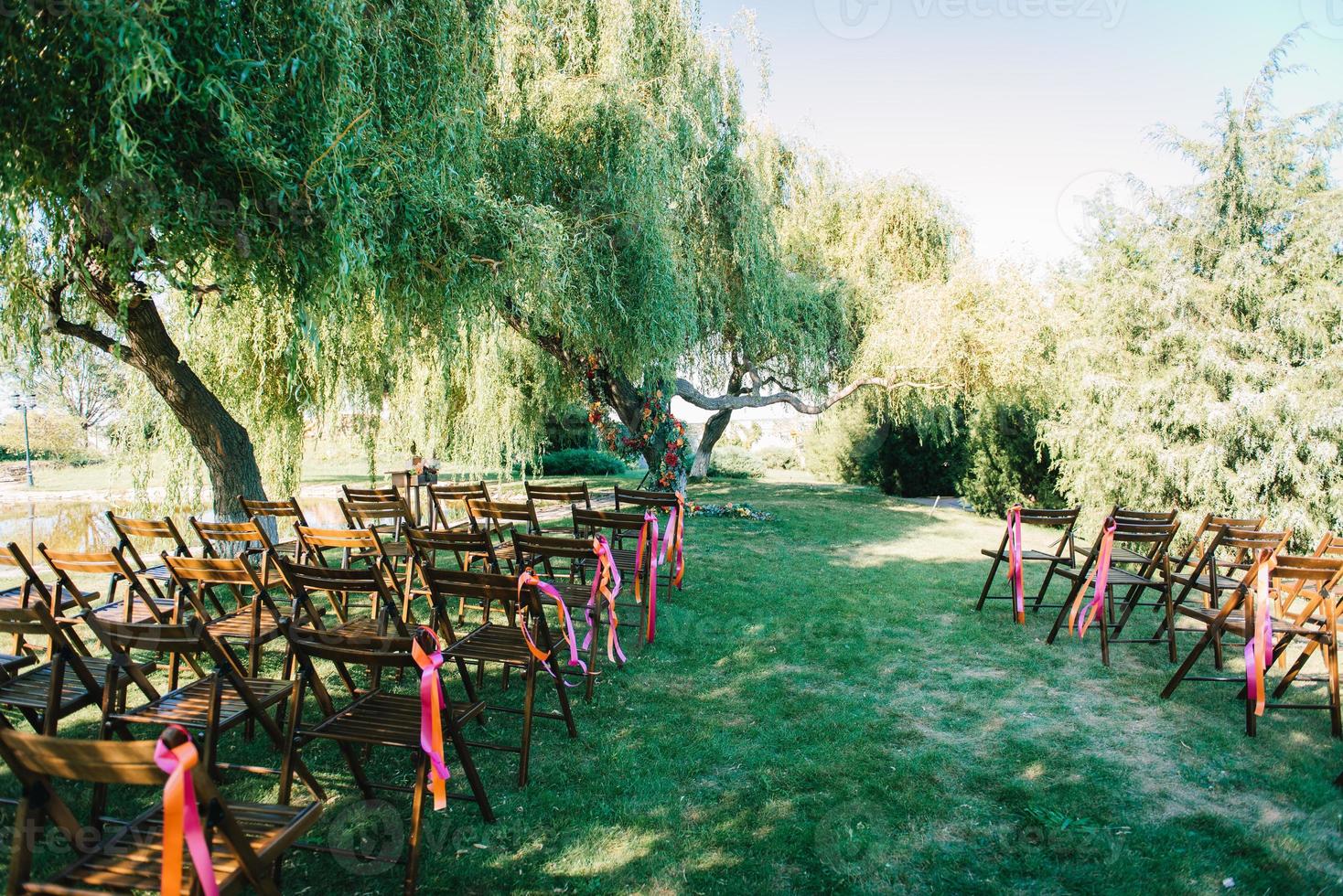 wedding ceremony area, arch chairs decor photo