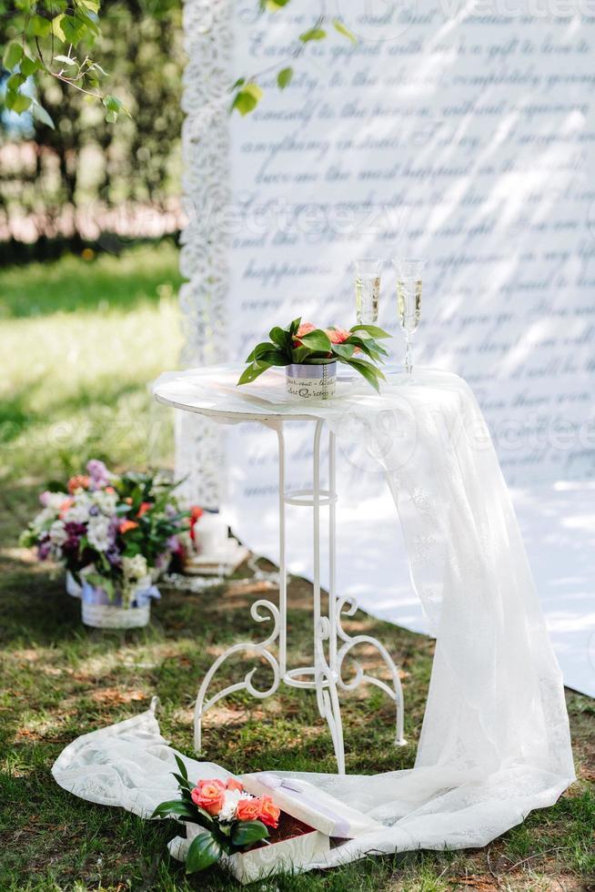 wedding ceremony in the woods among the trees on the green track photo