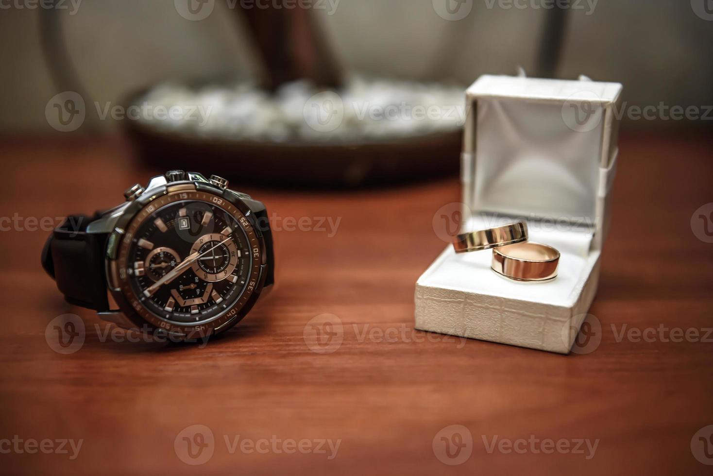 wedding ring in a box and watch the groom photo