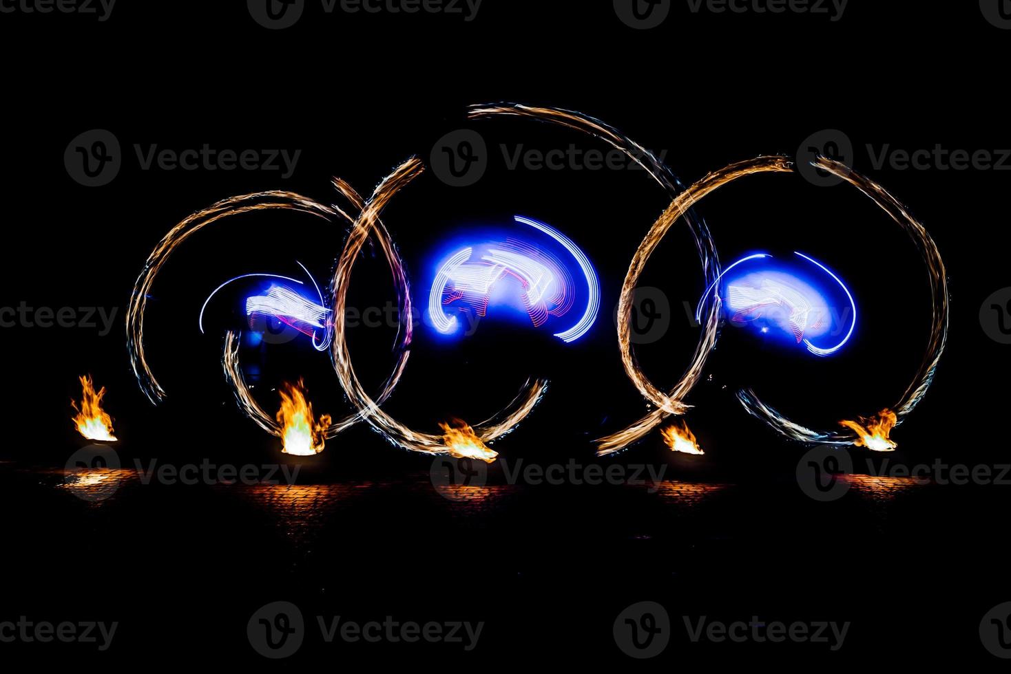 fiery pieces of a fire show photo