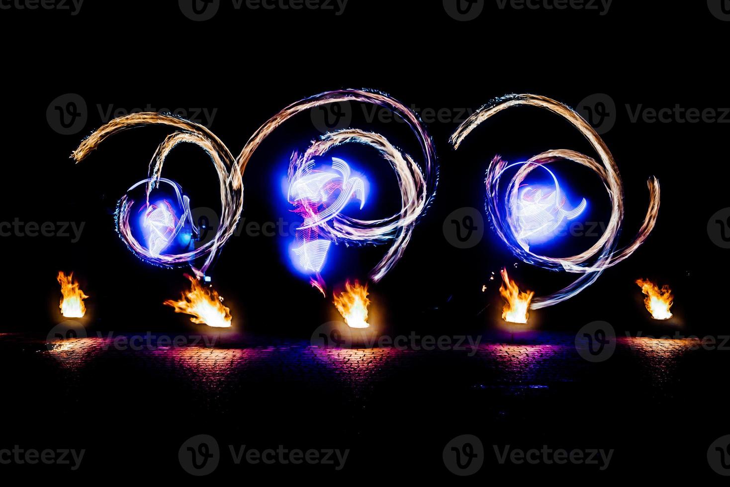 fiery pieces of a fire show photo