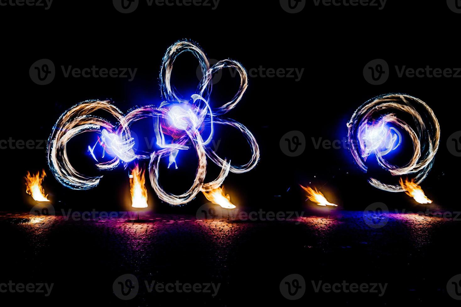 fiery pieces of a fire show photo