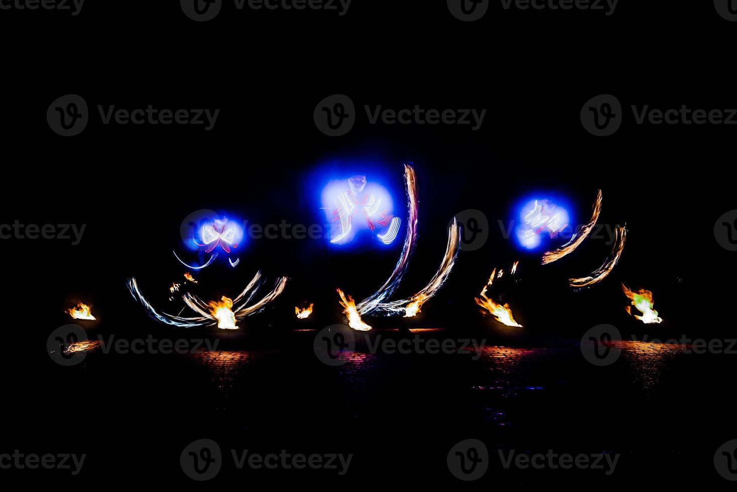 fiery pieces of a fire show photo